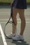 Woman\'s legs on tennis court