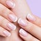 Woman\'s nails with beautiful french white manicure