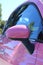 Woman\'s pink car