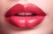 Woman\\\'s red lips closeup. Fillers or injection.