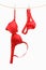 Woman\'s red underwear hanging on rope