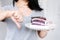 Woman\'s Resolute Gesture: Rejecting Sugar Temptation by Refusing to Indulge in Cake and Sweet Desserts