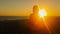 Woman`s silhouette doing yoga against a beautiful sunset.