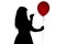 Woman\'s silhouette pierced with a needle balloon