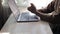 Woman`s stressed hands near laptop