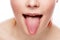 Woman\'s tongue. Woman with open mouth and pink toungue.