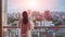 A Woman\\\'s Tranquil Moment with a City View from the balcony Generative AI