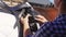 Woman Saddling Up Her Horse For A Competition - Tying Up Leather Strap Of Saddle