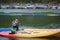 Woman sailing kayak boat in water sport pool