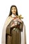 Woman Saint Sculpture Holding Cross Isolated Photo