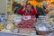 Woman sale Italian traditional foods at Christmas fair
