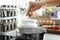 Woman salting boiling water in pot on stove