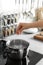 Woman salting boiling water in pot on stove