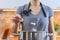 Woman salting water in a pot on a stove in the kitchen