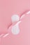 Woman sanitary pad with pink ribbon