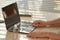 Woman Sanitizing Laptop at Workplace Closeup