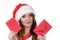 Woman in santa claus hat reading letter
