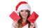 Woman in santa claus hat reading letter