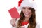 Woman in santa claus hat reading letter