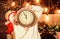 Woman Santa hat hold vintage clock. Time to celebrate. New year countdown. Merry christmas. Time for miracles. Few