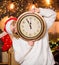 Woman Santa hat hold vintage clock. Time to celebrate. New year countdown. Unexpectedly soon. Midnight concept. Make