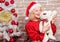 Woman santa hat hug soft toy bear. Best gift ever. Girl happy celebrate new year christmas. Receive teddy bear as gift