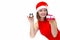 Woman in santa hat, red dress holds gift and clock in hands. new year is coming. girl with alarm clock 12 hours and present.