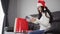 Woman in santa hat shopping online for Christmas gift with digital tablet in living room