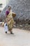 Woman in saree walking on street in Pondicherry, India.