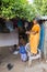 Woman in saree walking on street in Pondicherry, India.