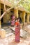 Woman in saree walking on street in Pondicherry, India.