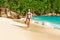 Woman with sarong on beach at Seychelles