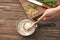 Woman with saucepan full of tasty rice