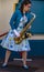 Woman Saxophone Player entertains Guests at Disney`s California Adventure