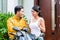 Woman saying goodbye to motorcyclist