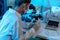 Woman scientist chemist working in modern laboratory
