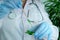 Woman scientist prepares a sample of a leaf for analysis in a university laboratory, studies plant dna, concept science, chemistry