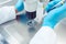 Woman scientist working with pipette in laboratory