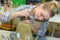 Woman scraping mold clay