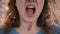 Woman is screaming because of nervous breakdown and stress at work. Concept stress pressure. Closeup of mouth woman