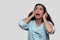 Woman screaming, suffering from mental illness, anxiety, depression, inner voices, schizophrenia, isolated on white