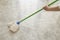 Woman scrubbing floor with a mop