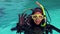 Woman in scuba diving doing ok sign