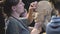 Woman sculptor at work on a sculpture of a human head.