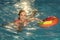 woman on sea with inflatable ring. happy woman swim with inflatable colorful ring in pool.
