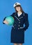 Woman in sea uniform with globe