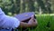 Woman Seamstress Stitching Amongst Lush Garden Greenery