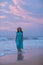 Woman at the seashore of Indian ocean after sunset