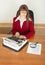 Woman secretary printing text on typewriter