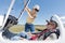 Woman securing cockpit over man in sailplane